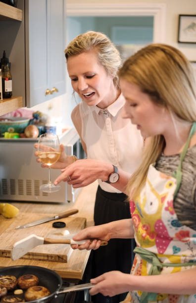 istock She is cooking a new recipe with a friend 1179646573