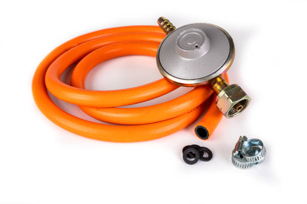 reducer, hose and clamps for gas installations. accessories for a home gas stove. white background. - botija de gas imagens e fotografias de stock