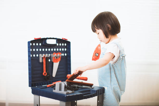 Toy craftsman tools on white background