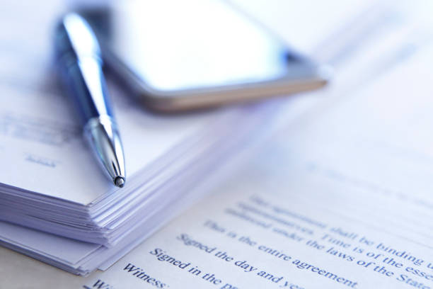 istock Ballpoint Pen Resting On Top Of Contract 1179648977