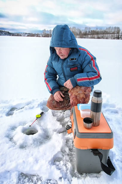 istock Lake Winter Fisherman 1179649029