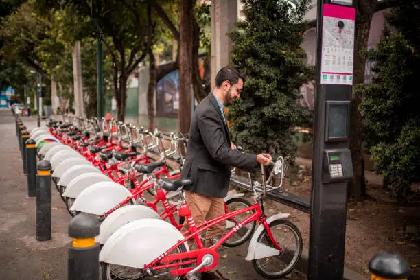 Businessman using a bicycle sharing system