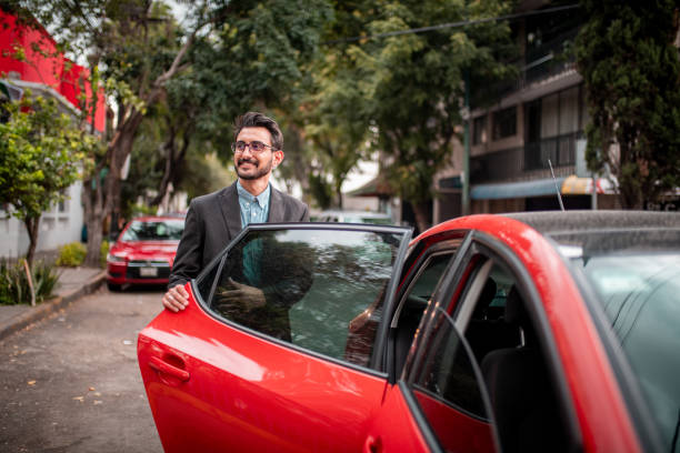 istock Businessman opening the car door 1179650455