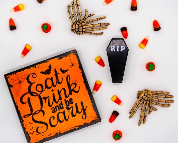 Spooky Halloween Flat Lay Cute candy corn and Halloween sign on a white background dre stock pictures, royalty-free photos & images