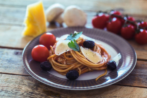 istock Spaghetti with tomato sauce and hard cheese on plate, close-up 1179655058
