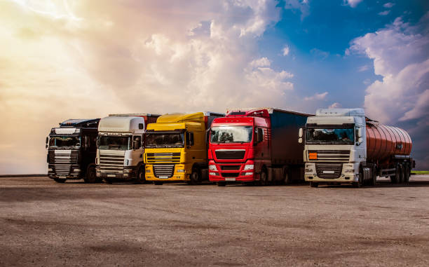istock powerful semi-trailers in a row in the Parking 1179655142