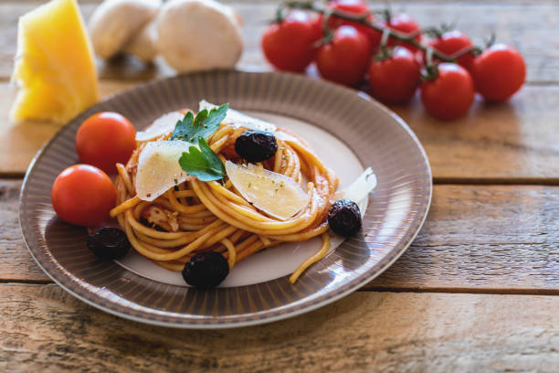 istock Spaghetti with tomato sauce and hard cheese on plate, close-up 1179655156