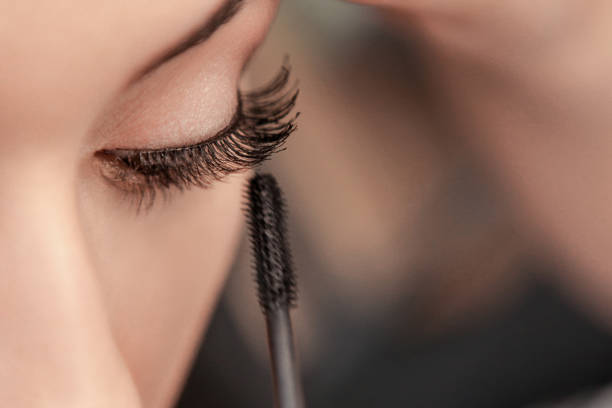 Mascara applying Mascara applying mascara stock pictures, royalty-free photos & images