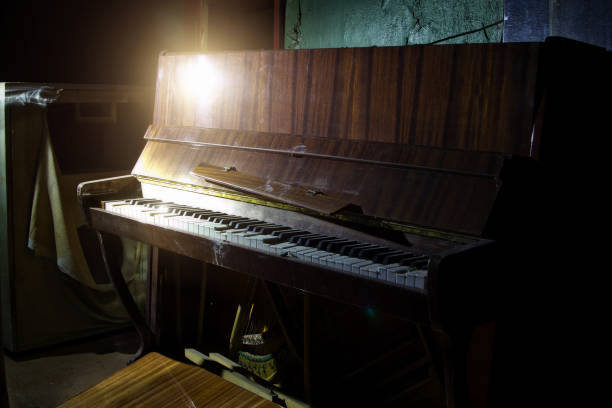 istock Old broken piano in ruined abandoned building 1179655347