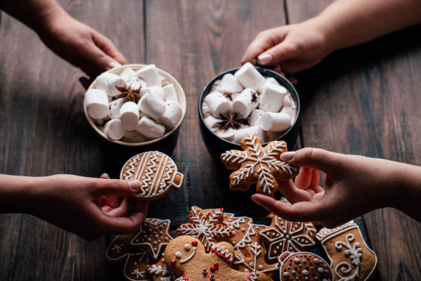 istock Friends eating festive sweets with hot chocolate 1179655832
