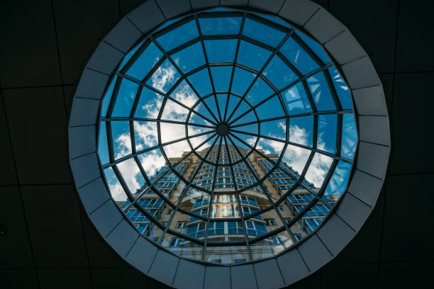 istock Looking up at modern building through glass transparent dome 1179657060