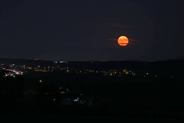 istock moonrise over the village 1179660869