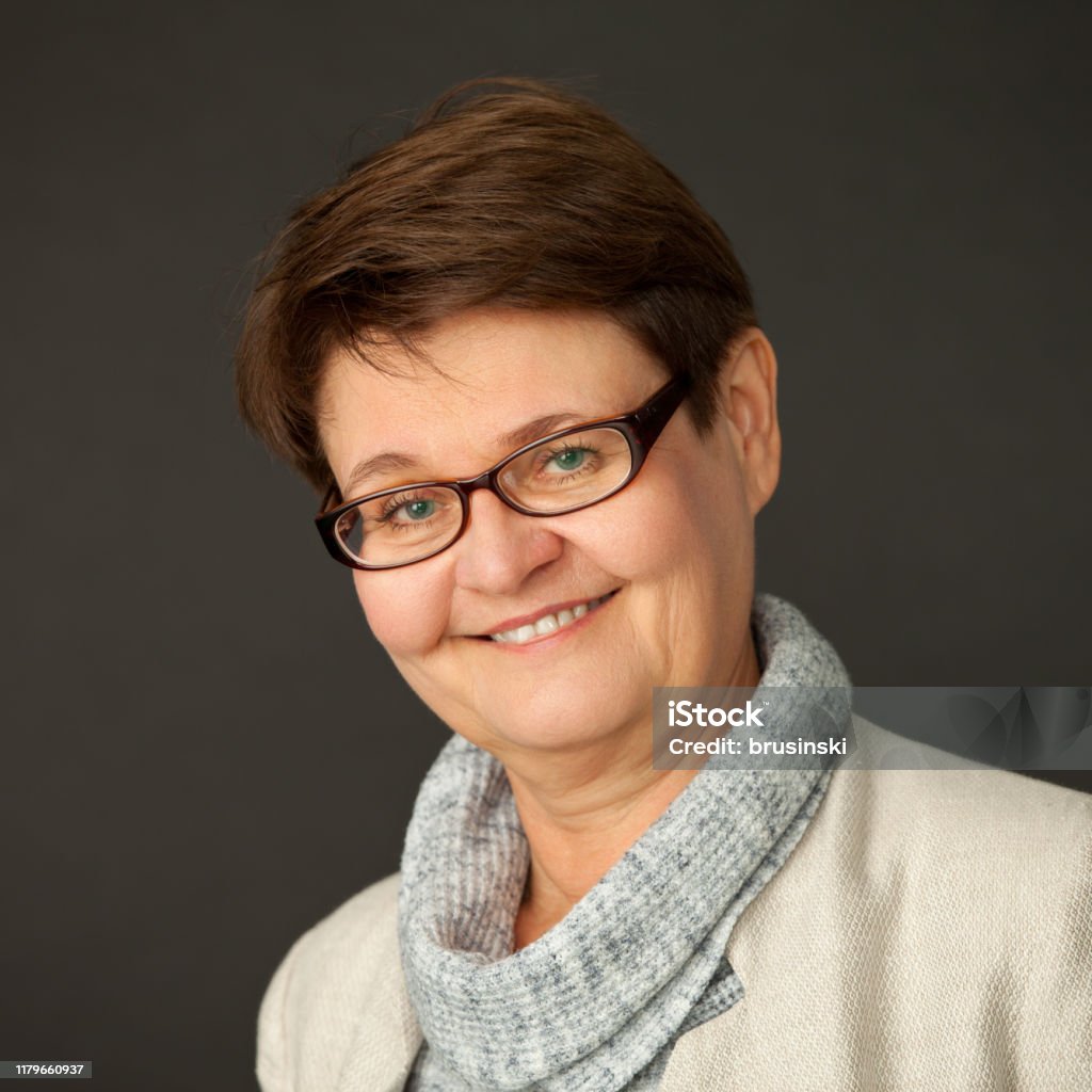 Studio Portrait Of An Attractive 58yearold Woman With A Short Haircut