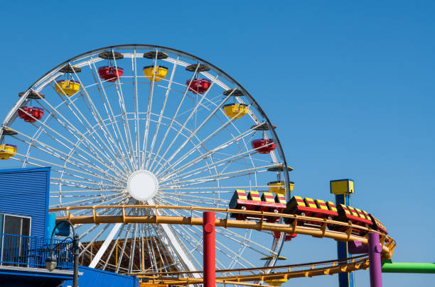 istock Amusement park scene of a ferris wheel and roller coaster 1179661010
