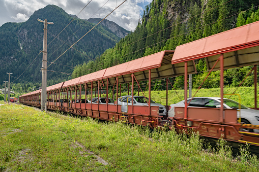 Loaded car train in Böckstein - Mallnitz. Station vehicles on train. Bad Gastein, Salzburg Land, Austria, traffic, transport, nobody, horizontal, Alps