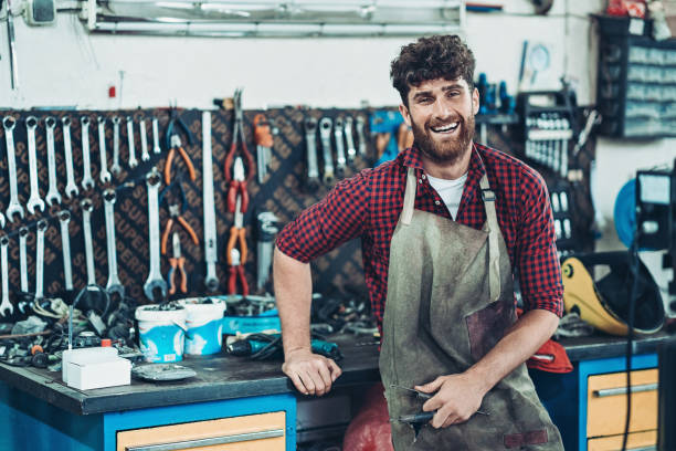 istock Happy biker in his garage 1179664294