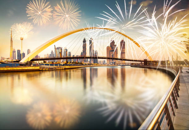 fireworks around Tolerance bridge - exotic New Year destination, Dubai, UAE stock photo