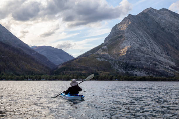 istock Man Kayaking in Glacier Lake 1179665394