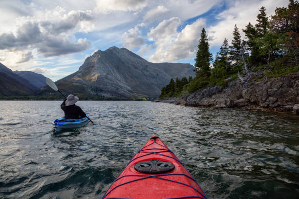 istock Man Kayaking in Glacier Lake 1179665449