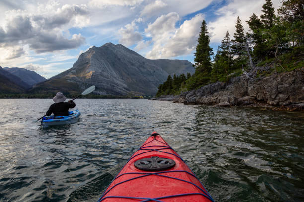 istock Man Kayaking in Glacier Lake 1179665452