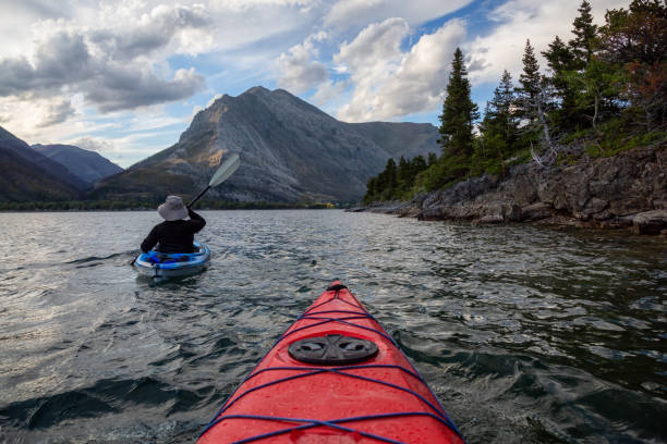 istock Man Kayaking in Glacier Lake 1179665455