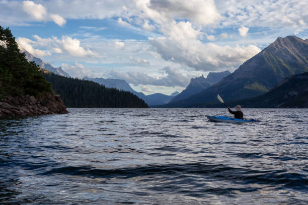 istock Man Kayaking in Glacier Lake 1179665494