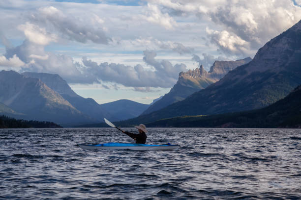 istock Man Kayaking in Glacier Lake 1179665498
