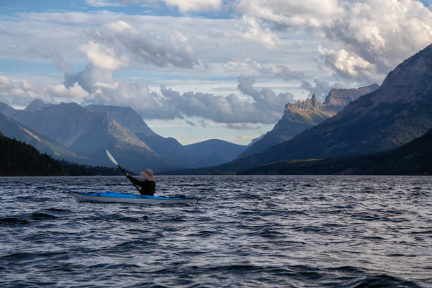 istock Man Kayaking in Glacier Lake 1179665512
