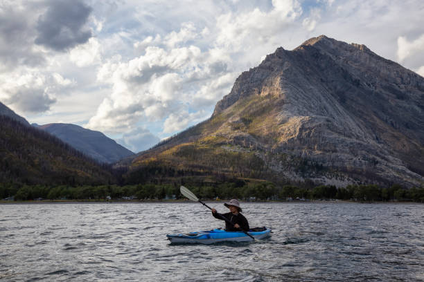 istock Man Kayaking in Glacier Lake 1179665517