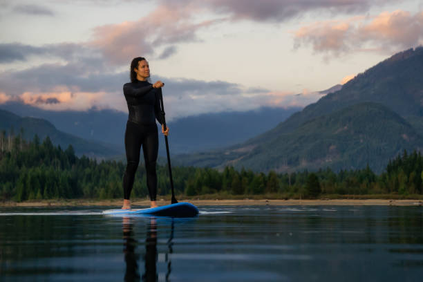 istock Girl Paddle Boarding in a Lake 1179665886