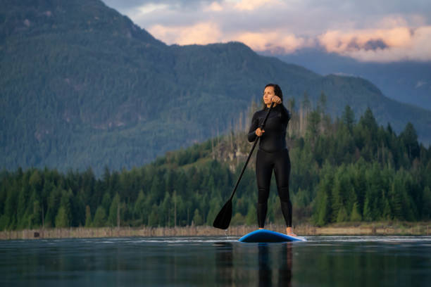 istock Girl Paddle Boarding in a Lake 1179666438