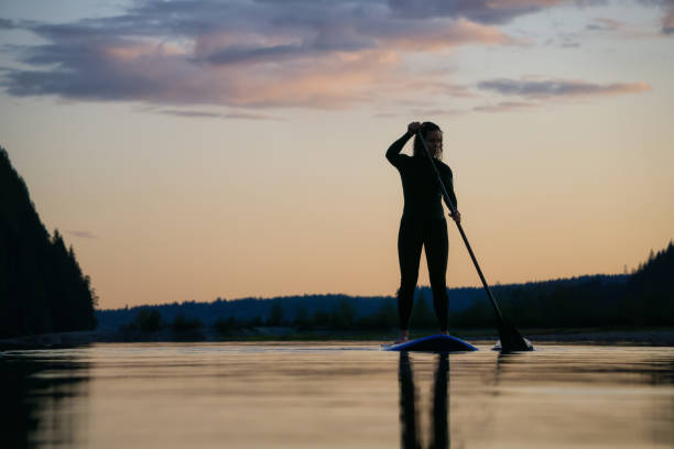istock Girl Paddle Boarding in a Lake 1179666451