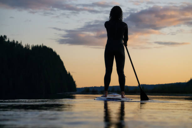 istock Girl Paddle Boarding in a Lake 1179666470