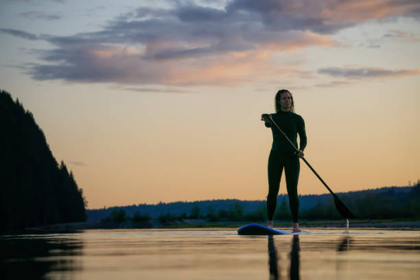 istock Girl Paddle Boarding in a Lake 1179666485