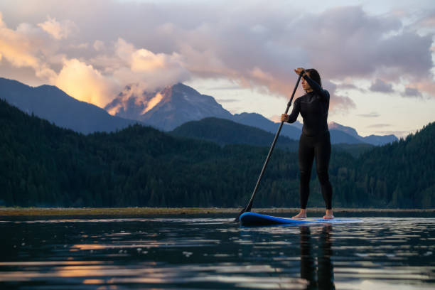 istock Girl Paddle Boarding in a Lake 1179666487