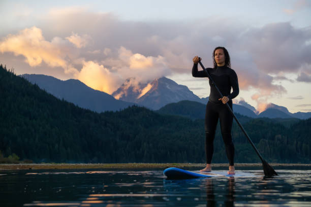 istock Girl Paddle Boarding in a Lake 1179666488