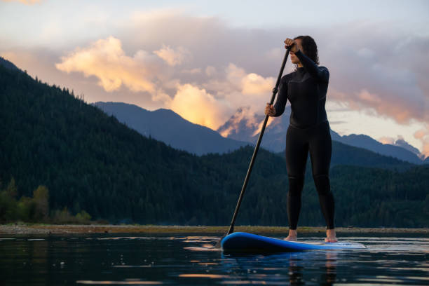 istock Girl Paddle Boarding in a Lake 1179666489
