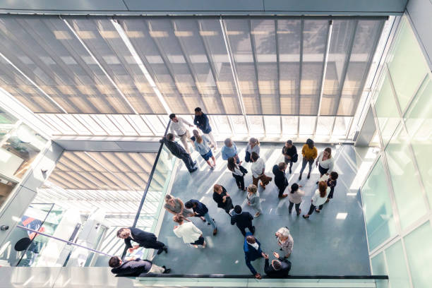 istock Overhead view of business people at work 1179666999