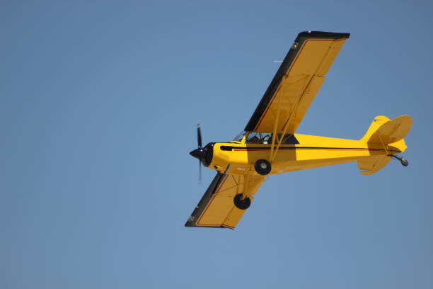 istock airplane with propeller flying in blue sky 1179668061