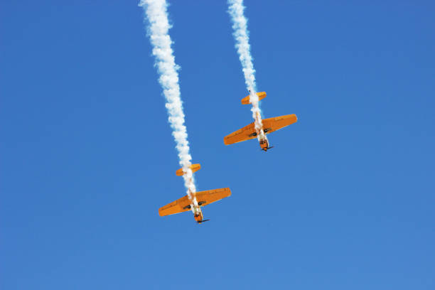 istock airplane with propeller flying in blue sky 1179668067