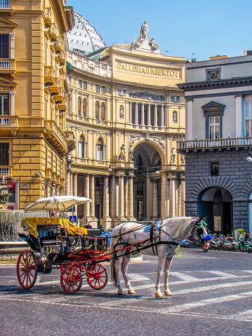 Horse carriage in front of the Galleria Umberto I in the old town