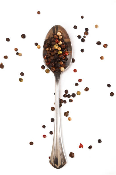 istock Metallic spoon and dried pepper grains 1179670198