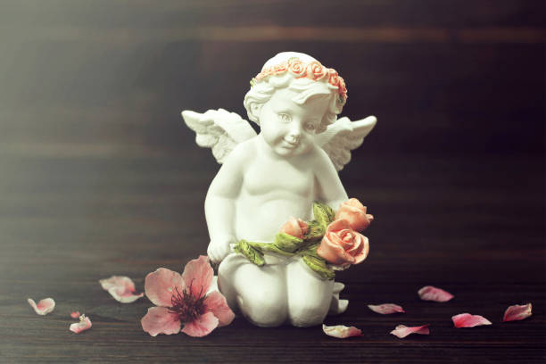 istock Guardian angel and spring flowers 1179671909