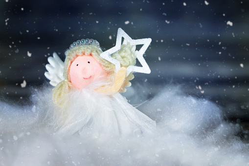 Cute Christmas angel holding star