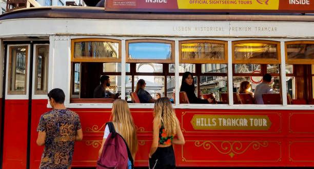 リスボン、ポルトガル - circa 9月、2019:リスボンを通過する観光赤いトラム - candid downtown district editorial horizontal ストックフォトと画像