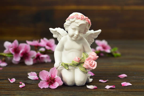 istock Guardian angel and spring flowers 1179672526