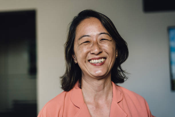istock Smiling Asian woman at home 1179672574