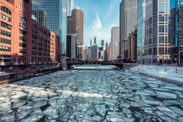 Beautiful Chicago downtown cityscape twilight winter view during snowfall. Illinois, Midwest USA.