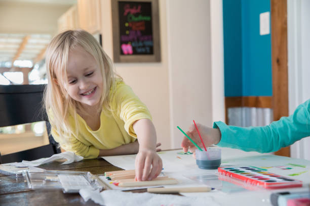 istock Preschool age child doing arts and crafts 1179673063