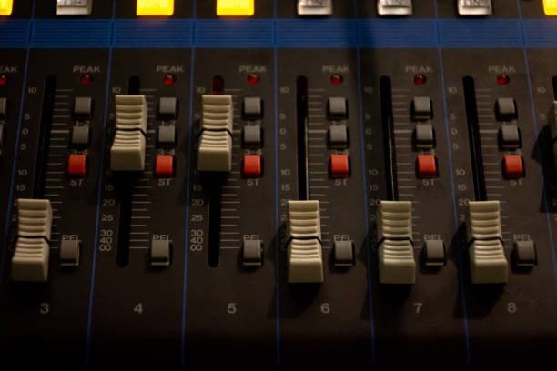 istock Sound mixer control panel on dark light background in audio control room. 1179676152